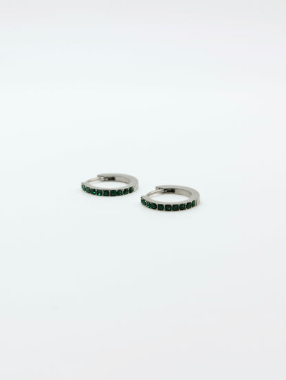 The Maija 'May' Emerald Birthstone Silver Finish Tarnish Free Crystal Huggie Hoop Earrings.