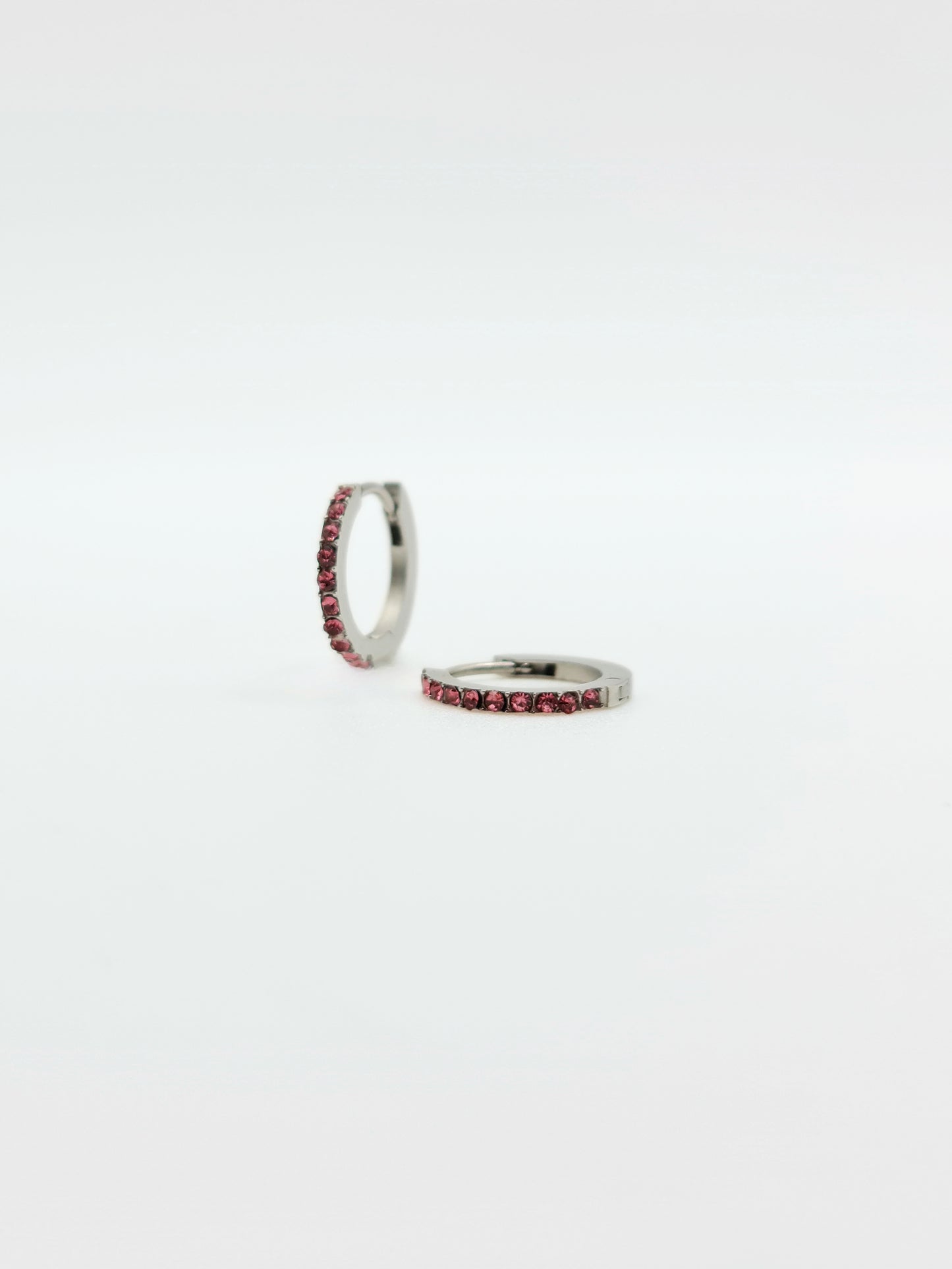 The Maija 'October' Tourmaline Birthstone Silver Finish Tarnish Free Crystal Huggie Hoop Earrings.
