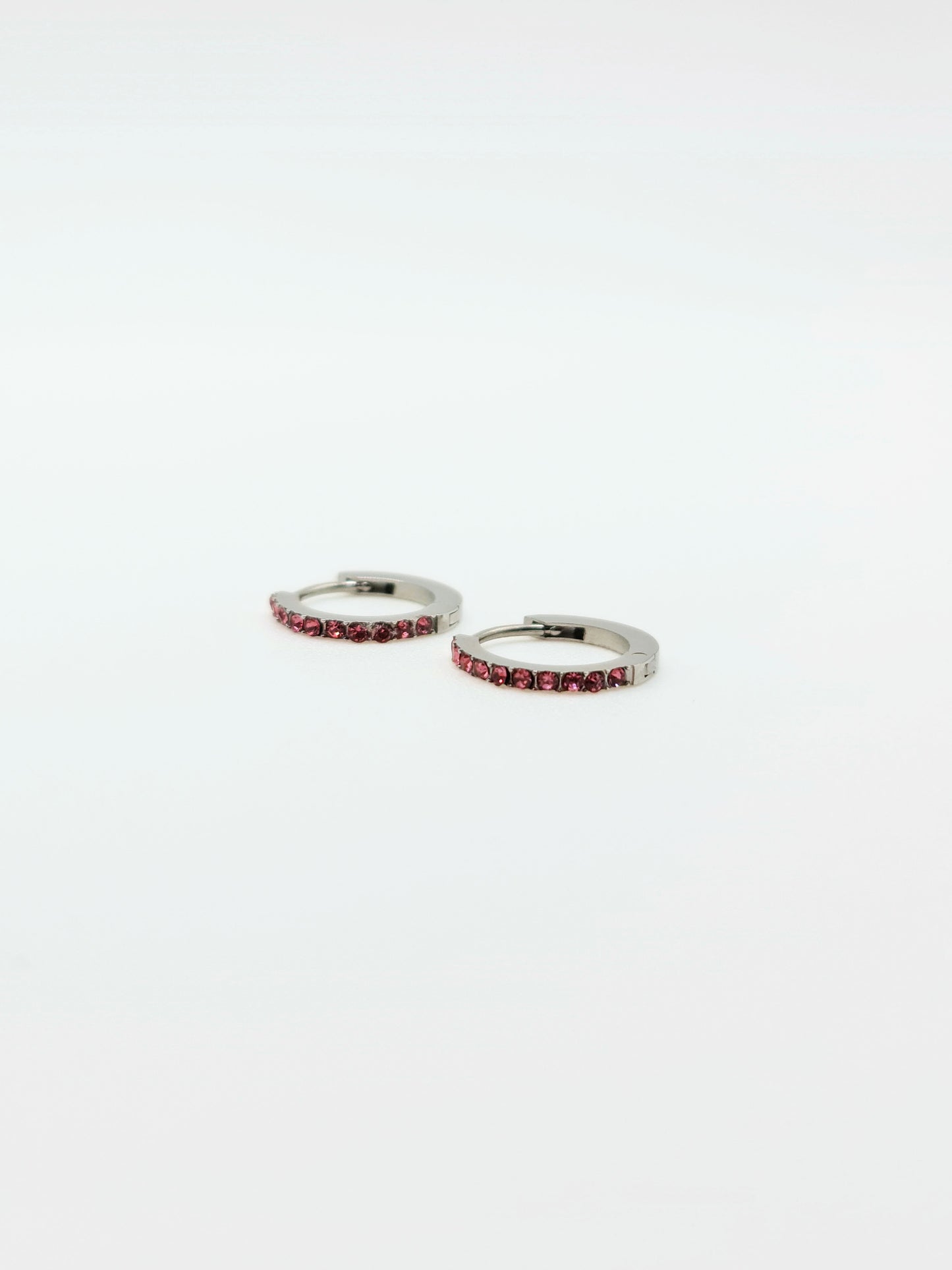 The Maija 'October' Tourmaline Birthstone Silver Finish Tarnish Free Crystal Huggie Hoop Earrings.