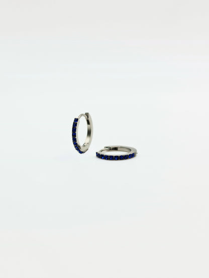 The Maija 'September' Sapphire Birthstone Silver Finish Tarnish Free Crystal Huggie Hoop Earrings.