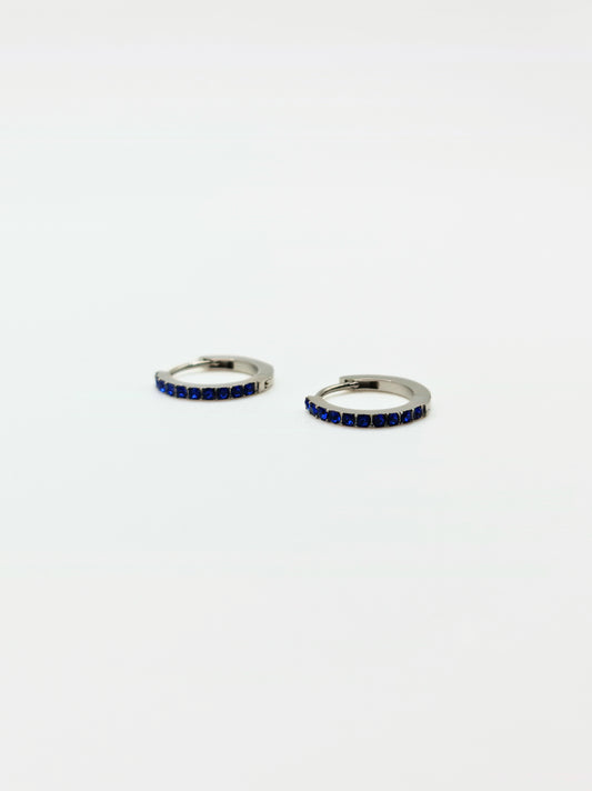 The Maija 'September' Sapphire Birthstone Silver Finish Tarnish Free Crystal Huggie Hoop Earrings.