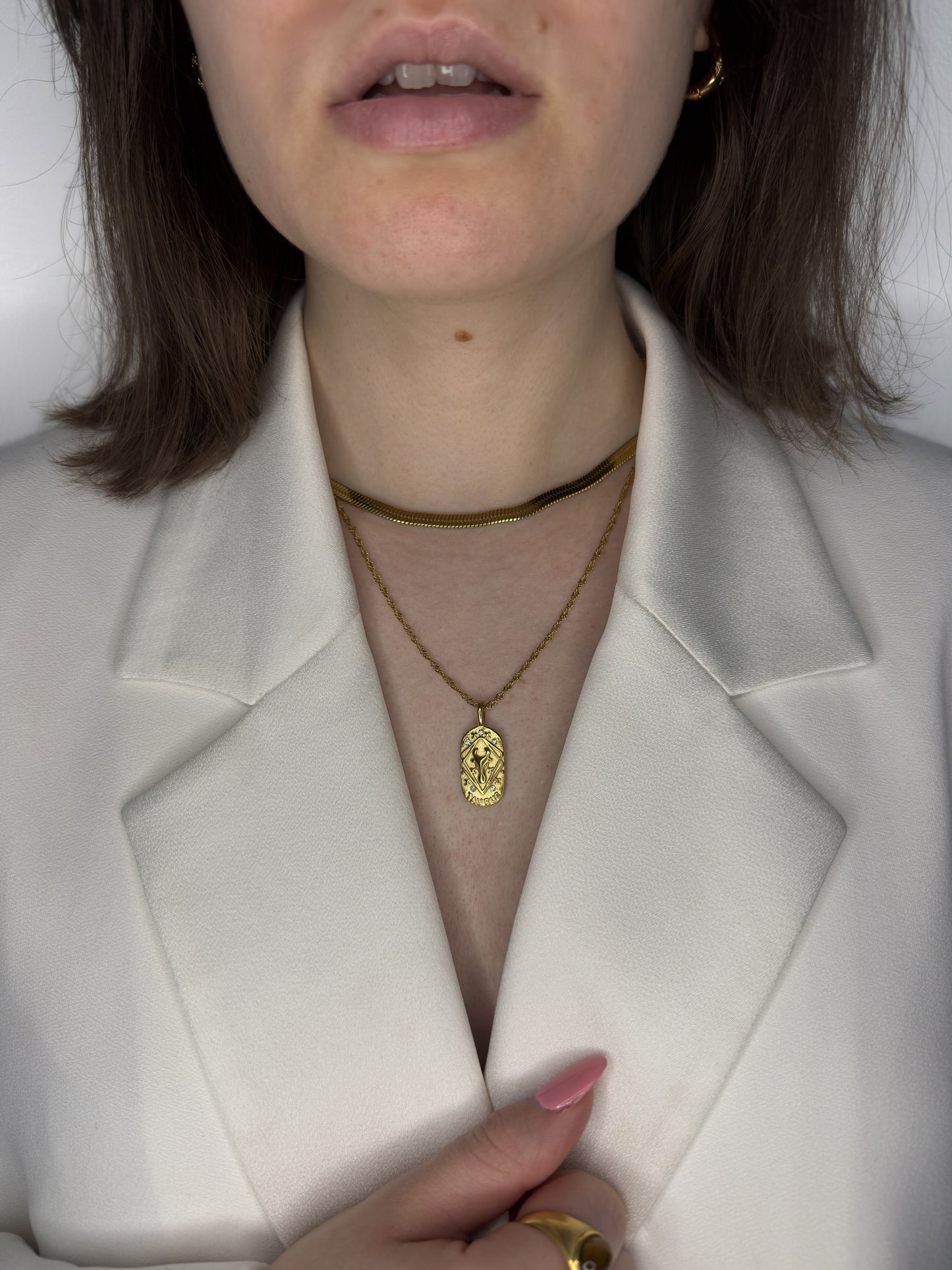 The Kiki Taurus 18k Gold Plated Stainless Steel Zodiac Starsign Crystal Necklace.