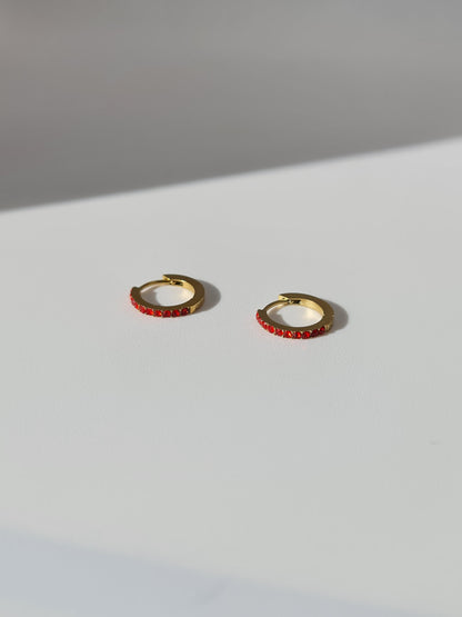 The Maija 'January' Garnet Birthstone 18k Gold Plated Stainless Steel Crystal Huggie Hoop Earrings.
