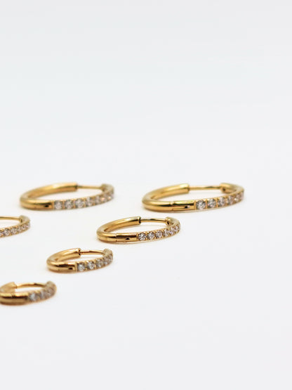 The Alaia Essentials 18k Gold Plated Tarnish-Free Crystal Pave Huggie Hoop Earrings in 12mm