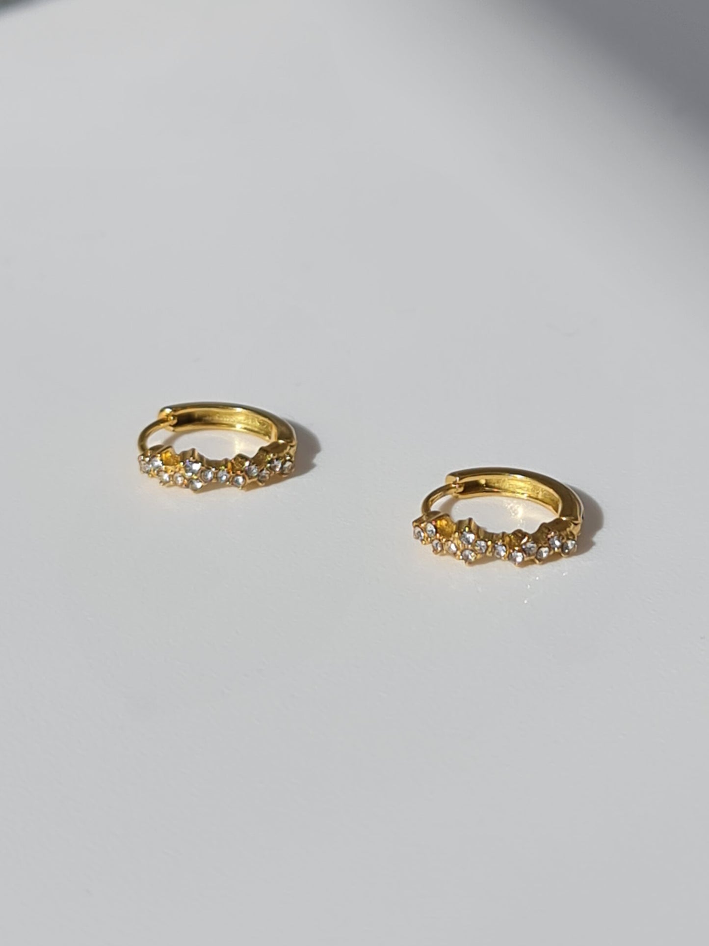 The Aurora 18k Gold Plated Stainless Steel Cubic Zirconia Pave Crystal Celestial Constellation Huggie Hoop Earrings.