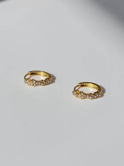 The Aurora 18k Gold Plated Stainless Steel Cubic Zirconia Pave Crystal Celestial Constellation Huggie Hoop Earrings.