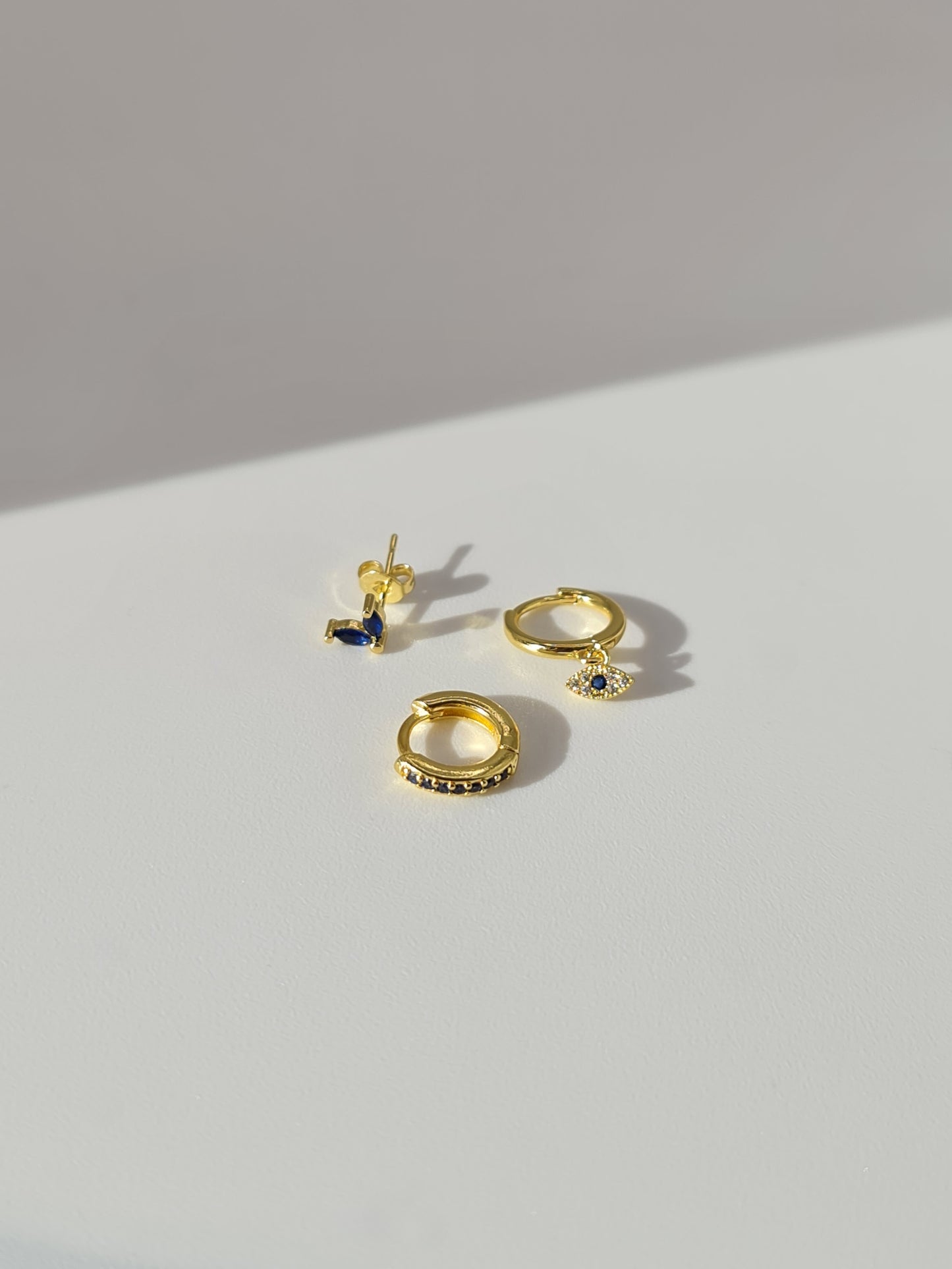 The Evil Eye 18k Gold Plated Stainless Steel Cubic Zirconia Matching Hoop and Stud 3pc Set.