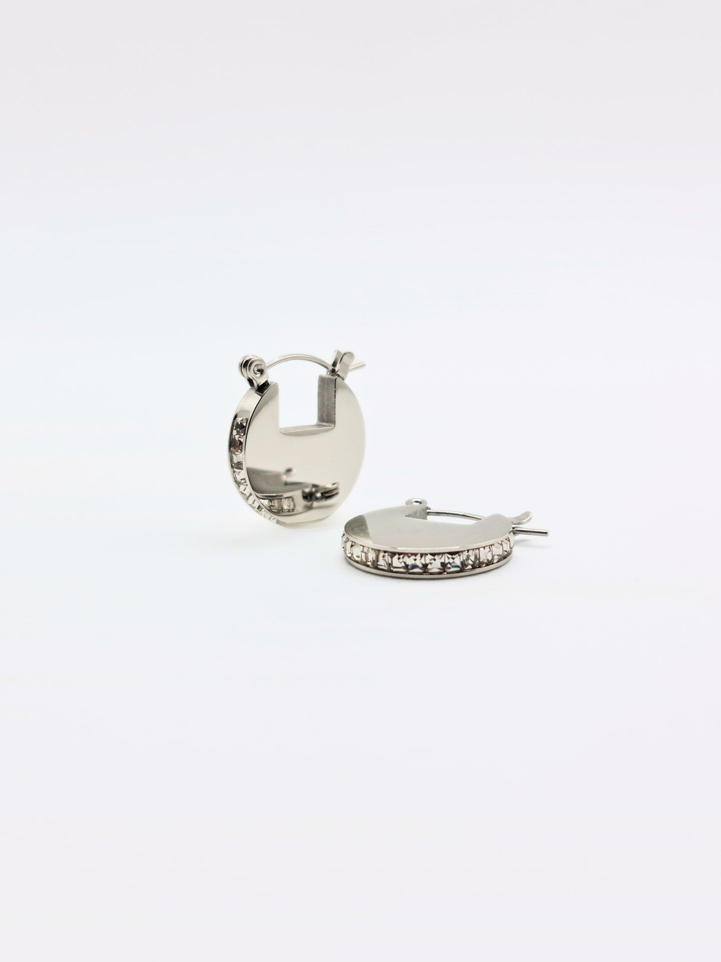 The Discus Silver Finish Tarnish-Free Crystal Disc Hoop Earrings