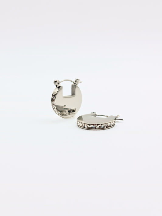 The Discus Silver Finish Tarnish-Free Crystal Disc Hoop Earrings