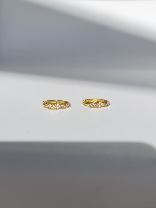 The Aurora 18k Gold Plated Stainless Steel Cubic Zirconia Pave Crystal Celestial Constellation Huggie Hoop Earrings.