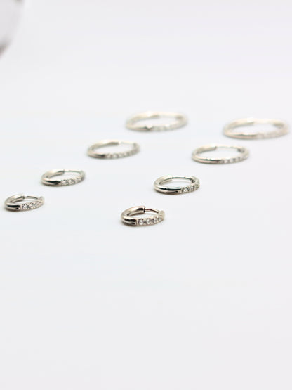 The Alaia Essentials Silver Finish Tarnish-Free Crystal Pave Huggie Hoop Earrings in 8mm