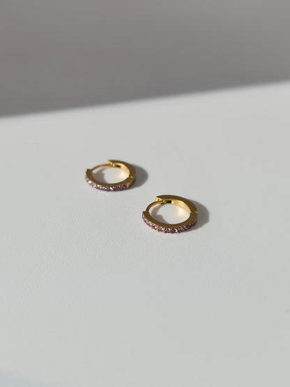 The Maija 'February' Amethyst Birthstone 18k Gold Plated Stainless Steel Crystal Huggie Hoop Earrings.