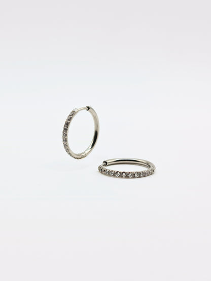The Alaia Essentials Silver Finish Tarnish-Free Crystal Pave Huggie Hoop Earrings in 16mm