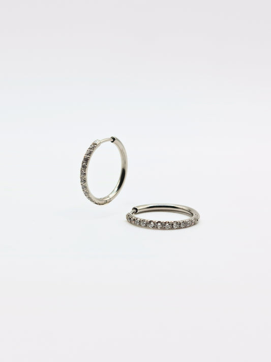 The Alaia Essentials Silver Finish Tarnish-Free Crystal Pave Huggie Hoop Earrings in 16mm
