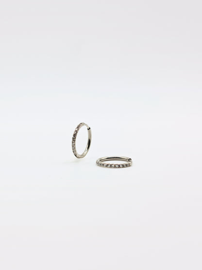 The Alaia Essentials Silver Finish Tarnish-Free Crystal Pave Huggie Hoop Earrings in 12mm