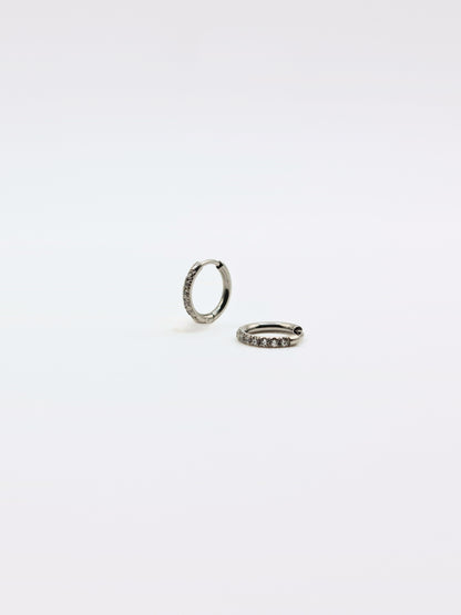 The Alaia Essentials Silver Finish Tarnish-Free Crystal Pave Huggie Hoop Earrings in 8mm