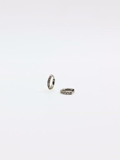 The Alaia Essentials Silver Finish Tarnish-Free Crystal Pave Huggie Hoop Earrings in 6mm