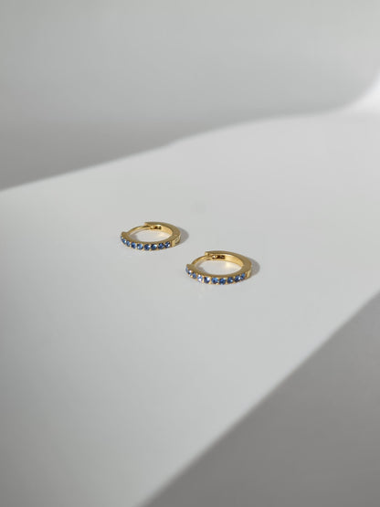 The Maija 'March' Aquamarine Birthstone 18k Gold Plated Stainless Steel Crystal Huggie Hoop Earrings.