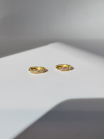 The Aurora 18k Gold Plated Stainless Steel Cubic Zirconia Pave Crystal Celestial Constellation Huggie Hoop Earrings.