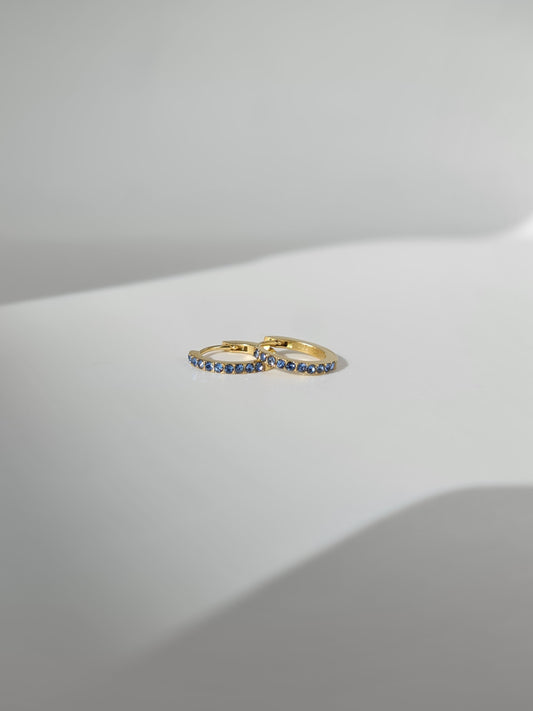 The Maija 'March' Aquamarine Birthstone 18k Gold Plated Stainless Steel Crystal Huggie Hoop Earrings.