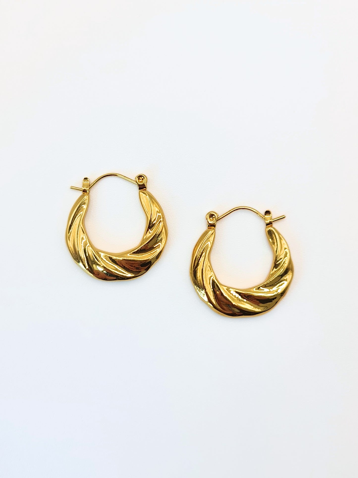 The Anastasia 18k Gold Plated Stainless Steel Medium Twist Hoop Earrings.
