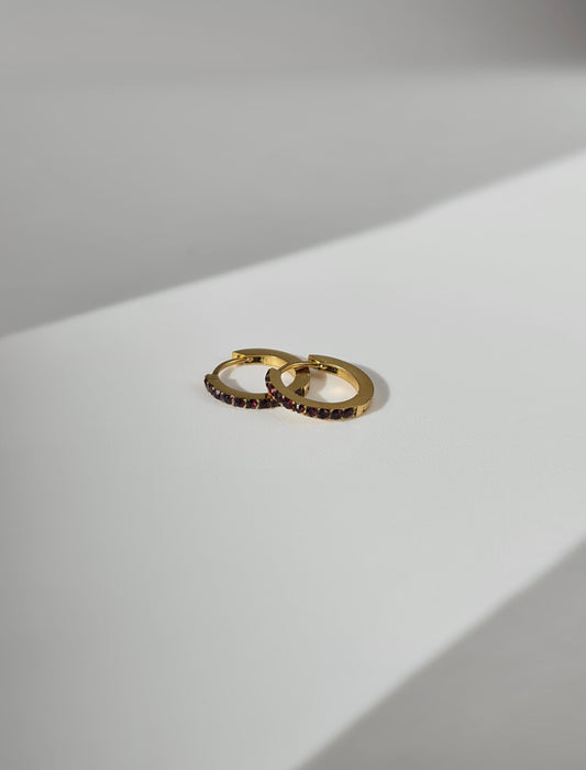 The Maija 'July' Ruby Birthstone 18k Gold Plated Stainless Steel Crystal Huggie Hoop Earrings.