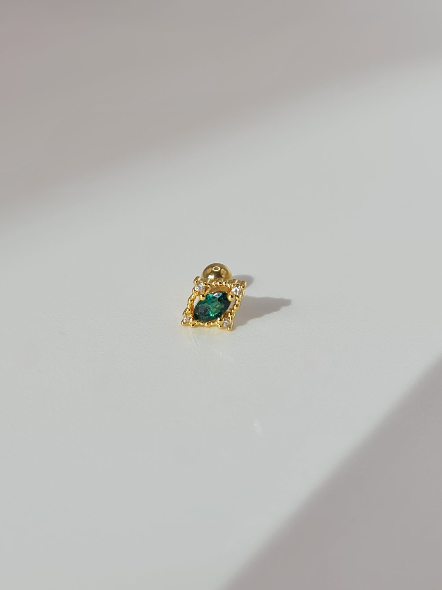 The Charlie 18k Gold Plated Stainless Steel Emerald Cubic Zirconia Cartilage Lobe Single Piercing Stud Earring.