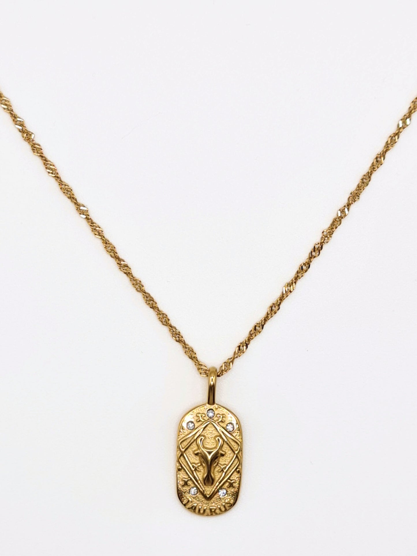 The Kiki Taurus 18k Gold Plated Stainless Steel Zodiac Starsign Crystal Necklace.