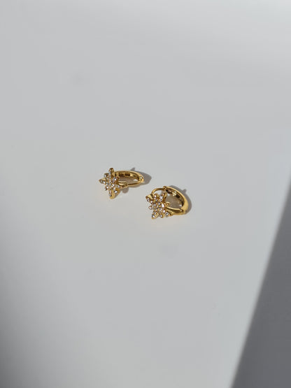 The Astra 18k Gold Plated Stainless Steel Cubic Zirconia Pave Crystal Celestial Star Huggie Hoop Earrings.