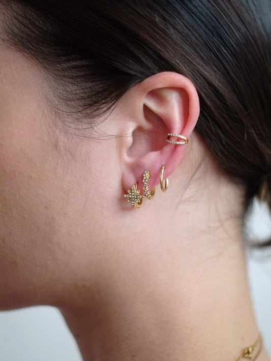 The Astra 18k Gold Plated Stainless Steel Cubic Zirconia Pave Crystal Celestial Star Huggie Hoop Earrings.