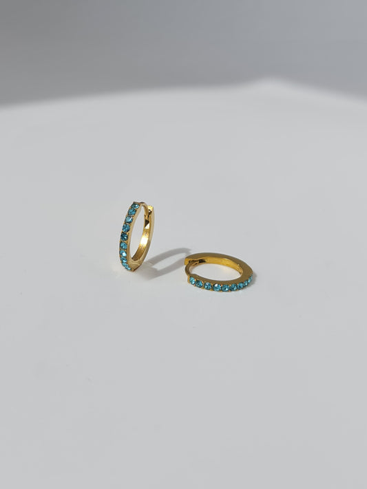 The Maija 'December' Turquoise Birthstone 18k Gold Plated Stainless Steel Crystal Huggie Hoop Earrings.
