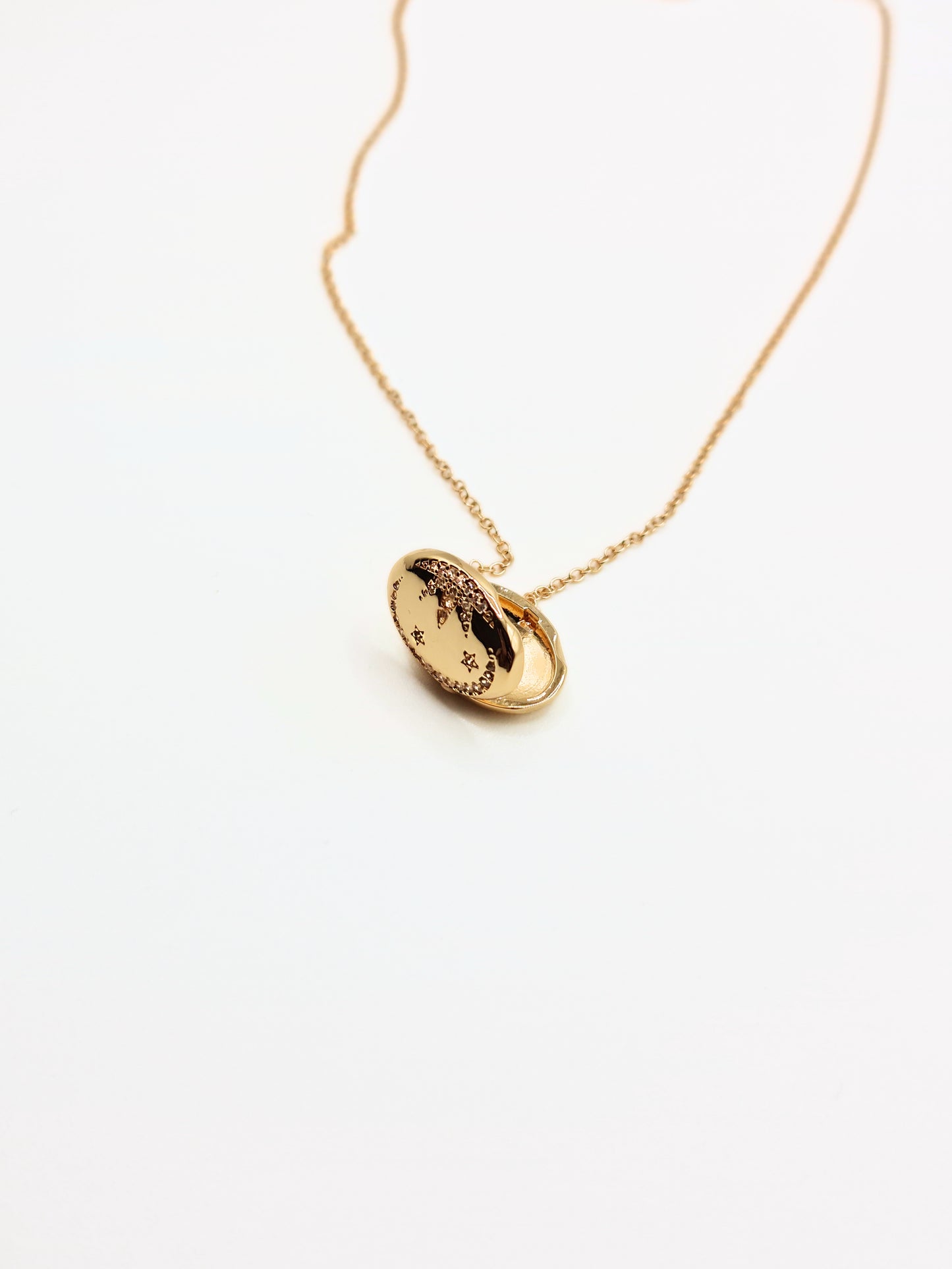 gold-crystal-celestial-star-oval-locket-stainless-steel-tarnish-free-jewellery-waterproof-ember-and-stone-1