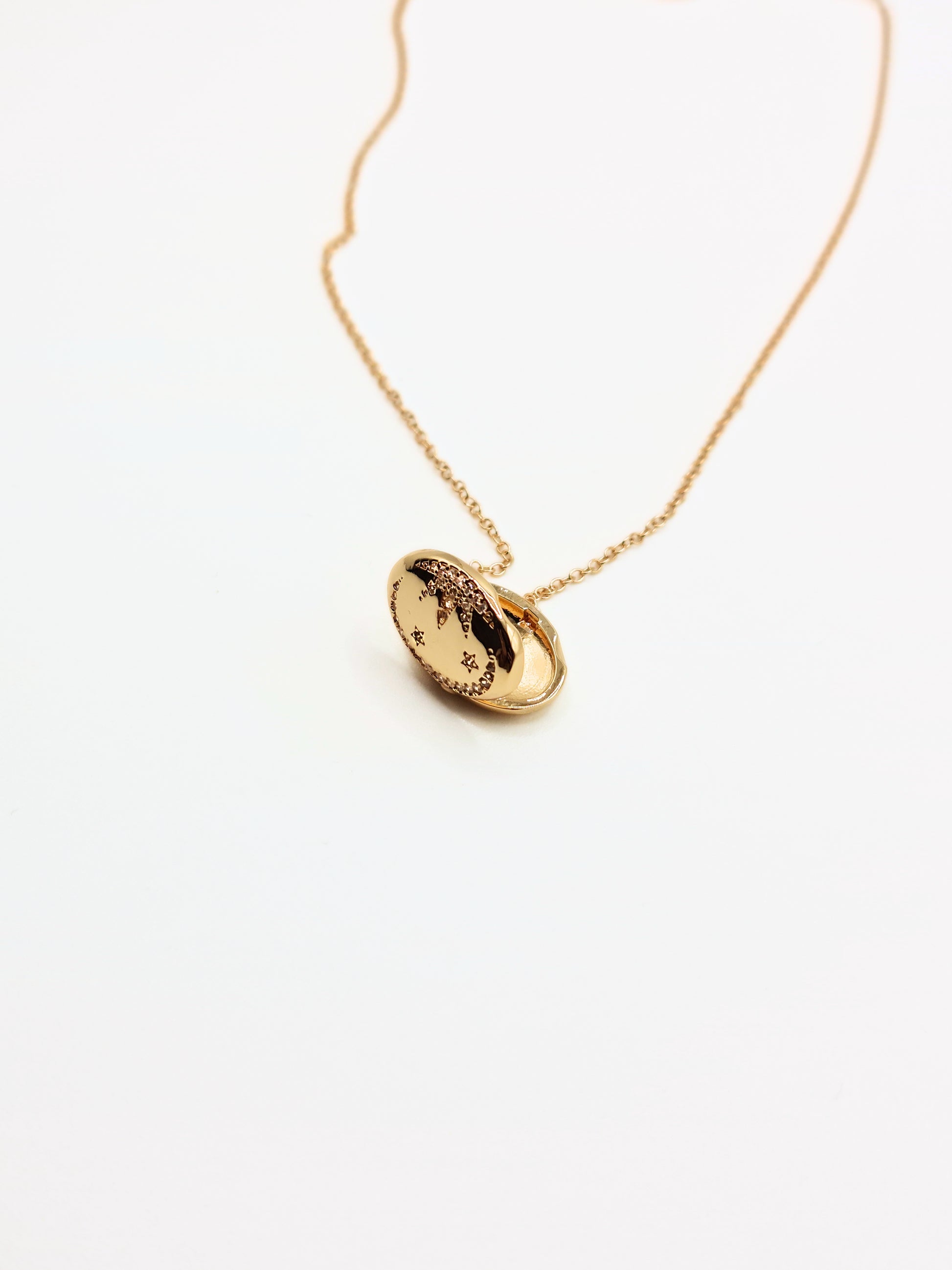 gold-crystal-celestial-star-oval-locket-stainless-steel-tarnish-free-jewellery-waterproof-ember-and-stone-1