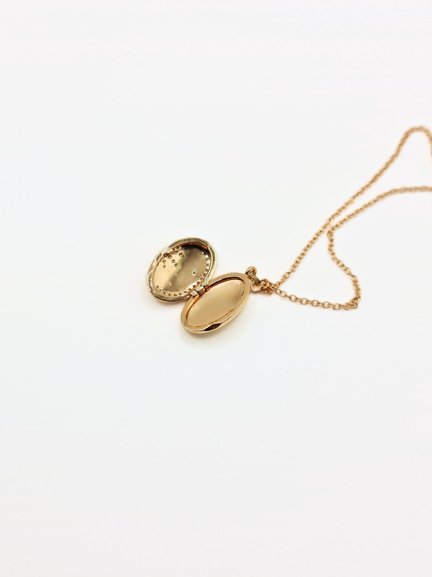 gold-crystal-celestial-star-oval-locket-stainless-steel-tarnish-free-jewellery-waterproof-ember-and-stone-1