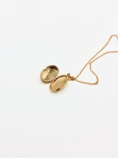 gold-crystal-celestial-star-oval-locket-stainless-steel-tarnish-free-jewellery-waterproof-ember-and-stone-1