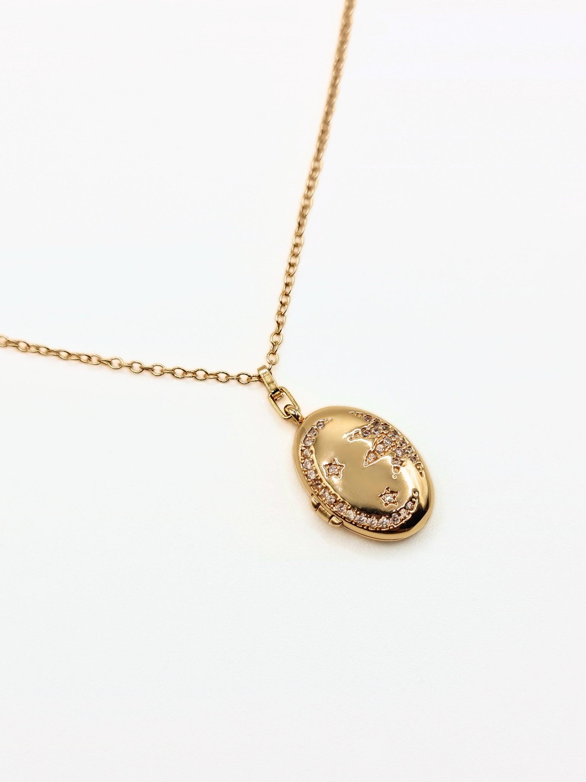 gold-crystal-celestial-star-oval-locket-stainless-steel-tarnish-free-jewellery-waterproof-ember-and-stone-1