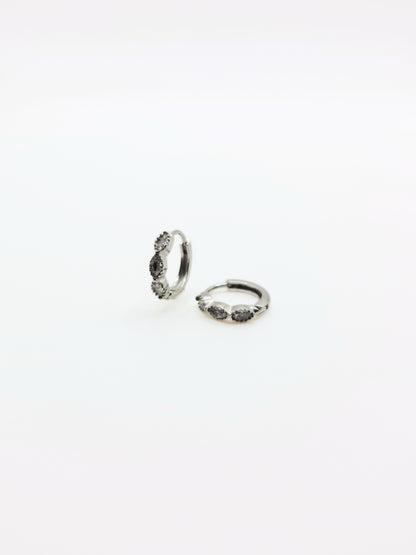 The Asteria Silver Finish Salt & Pepper Crystal Evil Eye Huggie Hoop Earrings- Waterproof & Tarnish-Free