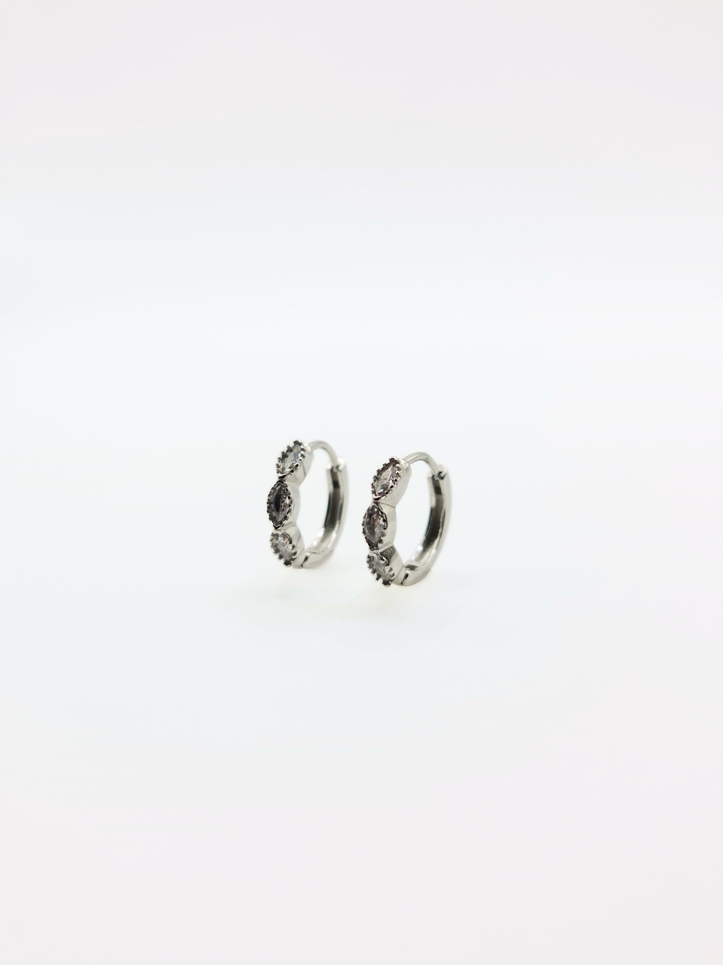 The Asteria Silver Finish Salt & Pepper Crystal Evil Eye Huggie Hoop Earrings- Waterproof & Tarnish-Free
