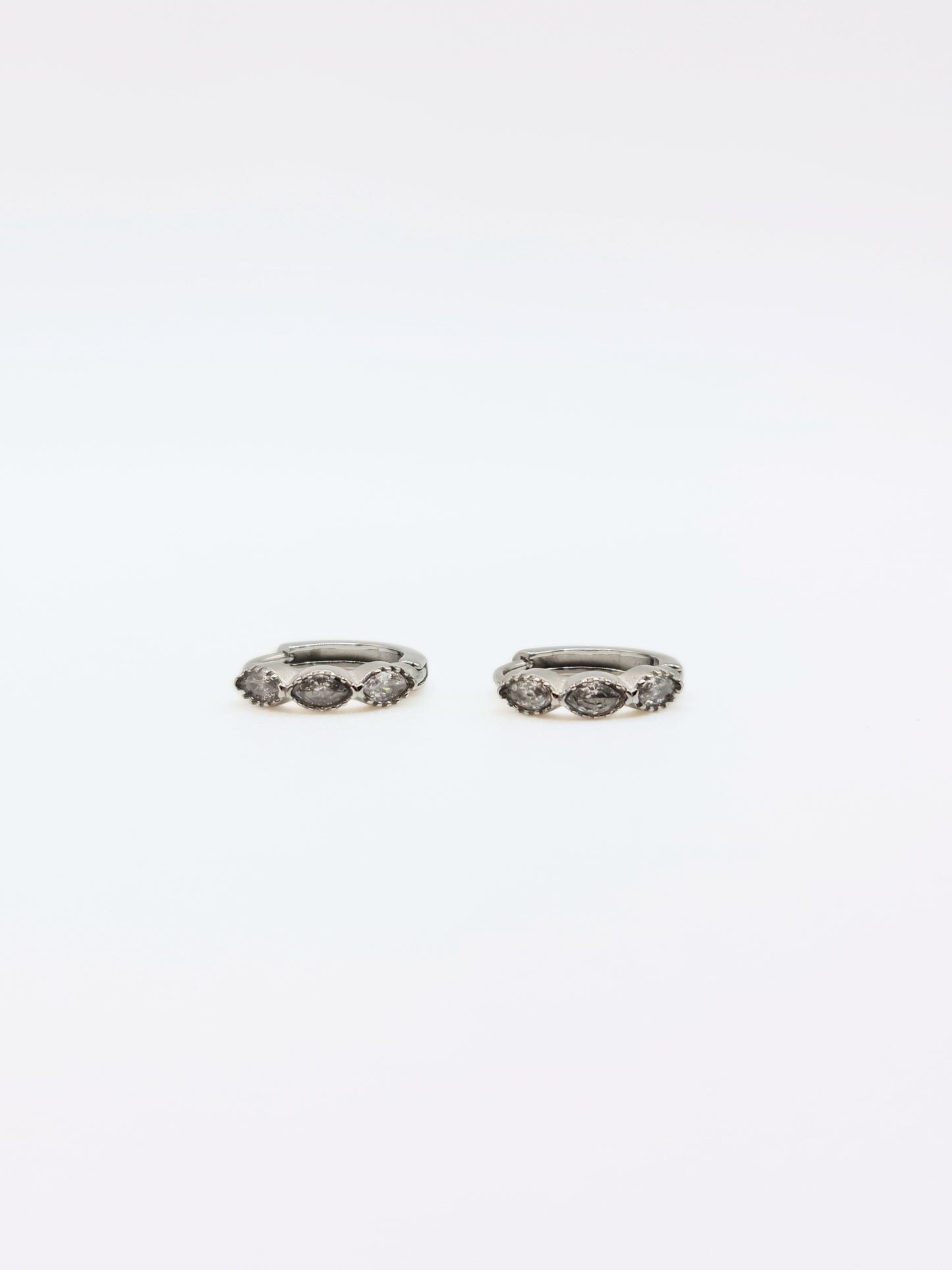 The Asteria Silver Finish Salt & Pepper Crystal Evil Eye Huggie Hoop Earrings- Waterproof & Tarnish-Free