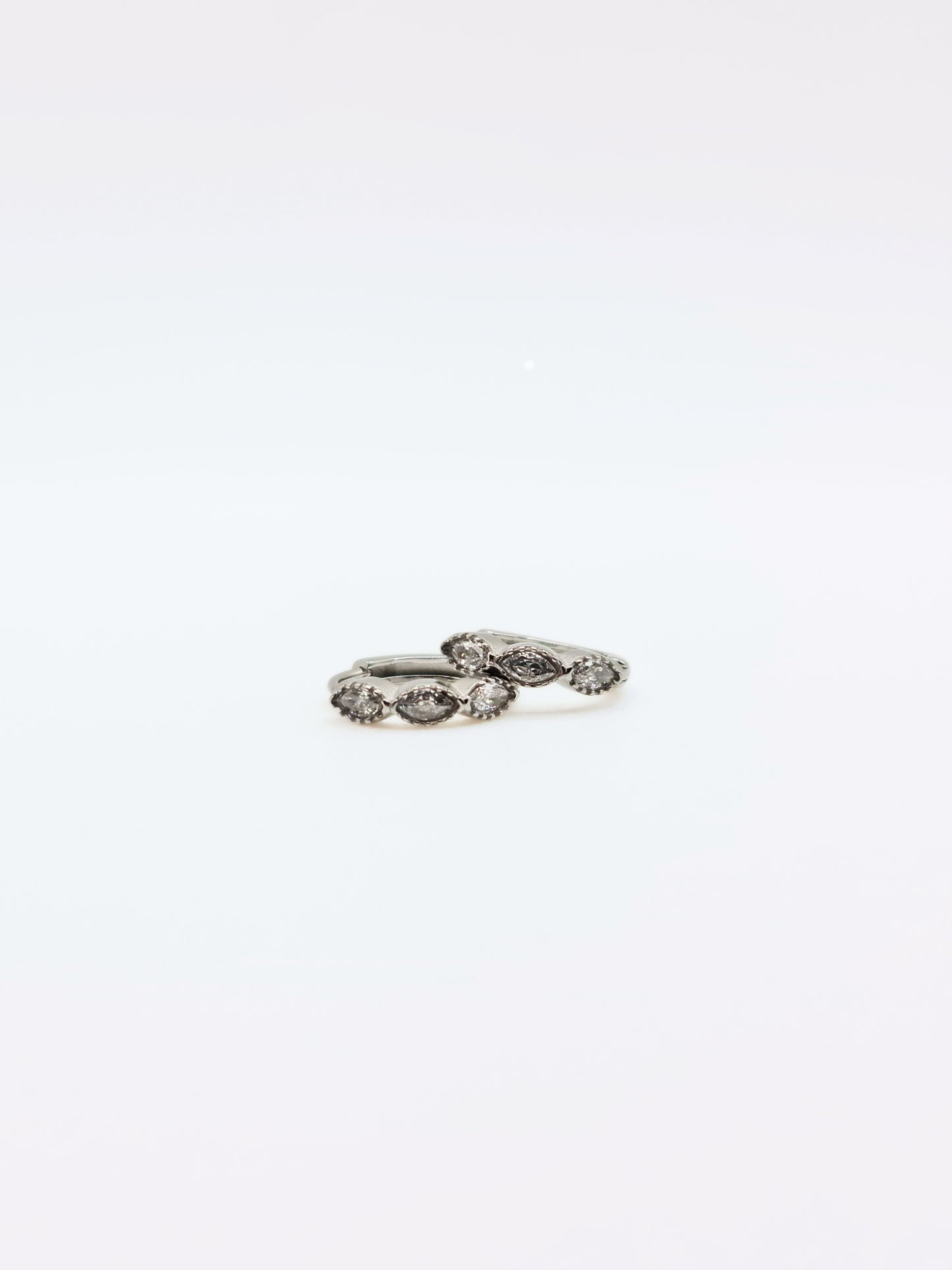 The Asteria Silver Finish Salt & Pepper Crystal Evil Eye Huggie Hoop Earrings- Waterproof & Tarnish-Free