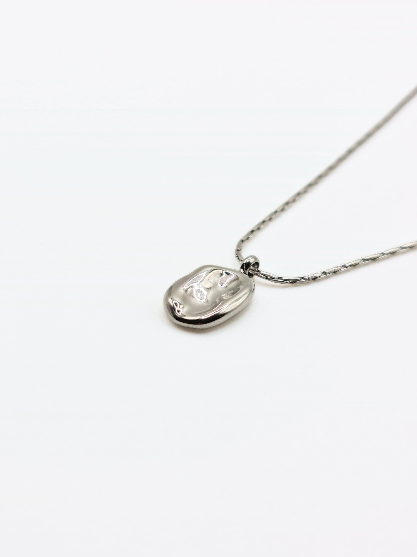 silver-organic-hammered-metal-pendant-necklace-stainless-steel-tarnish-free-jewellery-waterproof-ember-and-stone-2