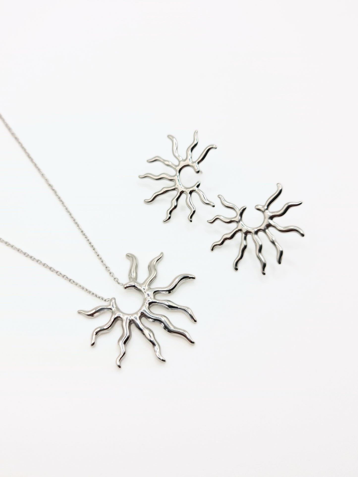 silver-sun-pendant-necklace-stud-earrings-matching-set-summer-stainless-steel-tarnish-free-jewellery-waterproof-ember-and-stone-1_f9a1e1c0-ce47-4bc7-9197-2eaf6c0348d1