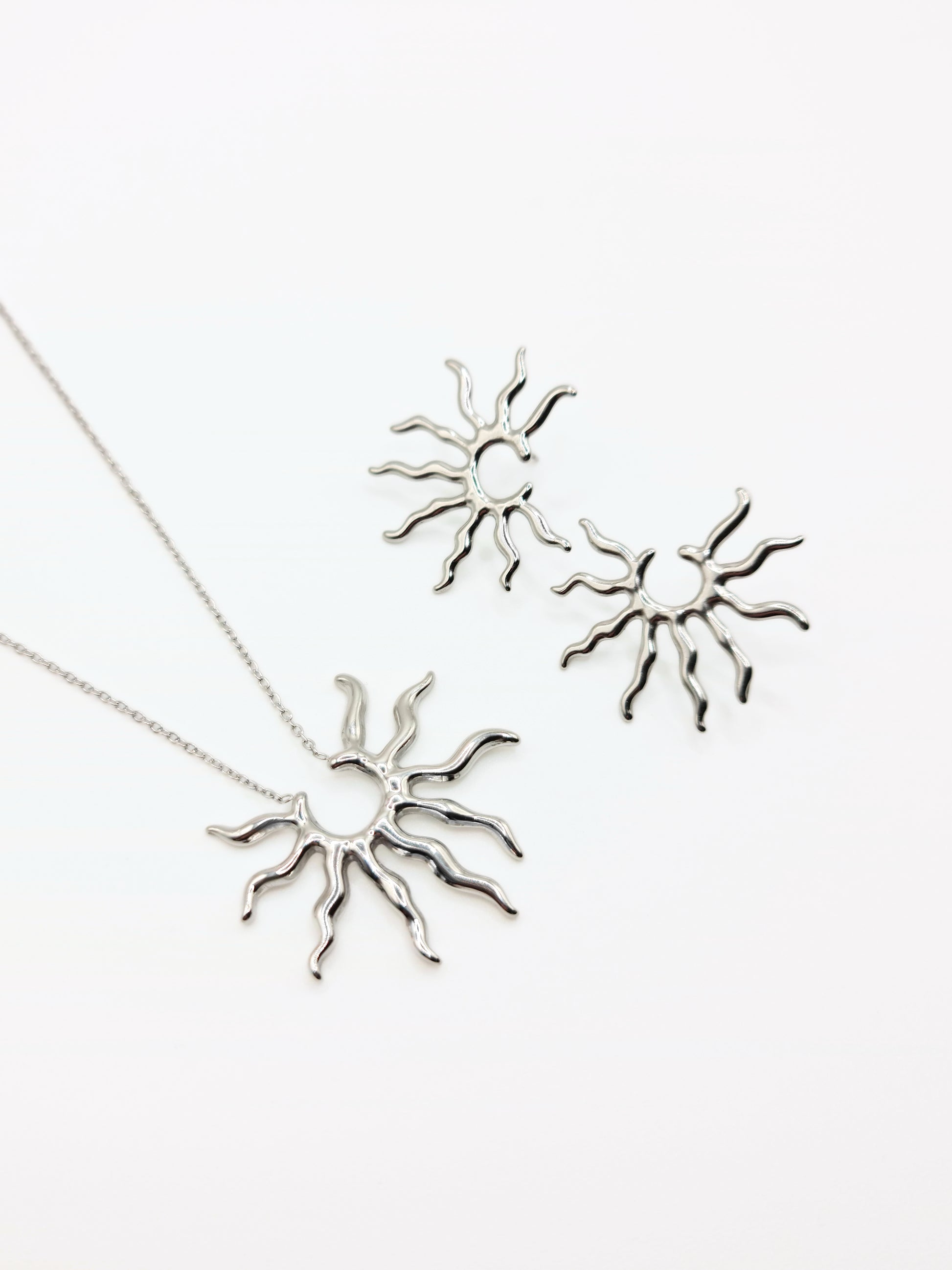silver-sun-pendant-necklace-stud-earrings-matching-set-summer-stainless-steel-tarnish-free-jewellery-waterproof-ember-and-stone-1_f9a1e1c0-ce47-4bc7-9197-2eaf6c0348d1